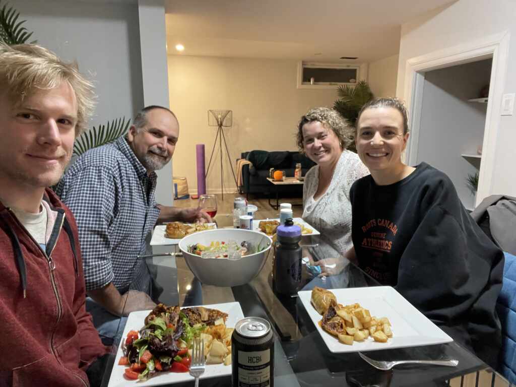 Kate's family happily eating at the dinner table