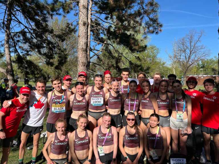 Team Canada posing together in a group photo in competition gear after the race.