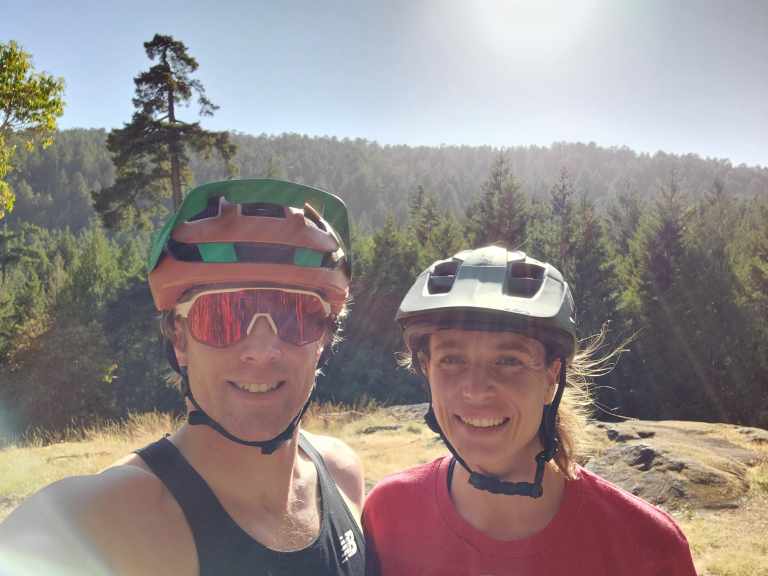Kate and Cody posing for a photo while out mountain biking